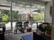 This patio is screened in and features hanging lights and chairs at 340 Barony Dr., Conway, SC 29526