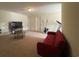 A large recreation room with plenty of open space and a red sofa at 340 Barony Dr., Conway, SC 29526