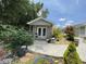 Exterior view of the shed with a walkway, set amidst lush greenery and landscaping at 340 Barony Dr., Conway, SC 29526