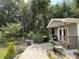 Outdoor shed has a small porch, surrounded by trees and landscaping at 340 Barony Dr., Conway, SC 29526