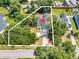 Aerial view of property with a highlighted boundary, showcasing its location and surrounding greenery at 3864 Journeys End Rd., Murrells Inlet, SC 29576