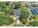 Aerial view of a home with a long driveway, lush landscaping, and mature trees at 3864 Journeys End Rd., Murrells Inlet, SC 29576