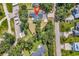 Birds-eye view of a property with surrounding mature trees and long driveway. The house features a dark shingle roof at 3864 Journeys End Rd., Murrells Inlet, SC 29576
