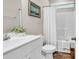 Bathroom featuring a single sink vanity, toilet, and tub with shower at 3864 Journeys End Rd., Murrells Inlet, SC 29576