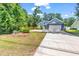 Beautiful home exterior with a well-maintained lawn, driveway, and attractive landscaping at 3864 Journeys End Rd., Murrells Inlet, SC 29576
