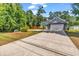 Charming home with a long driveway, attached two-car garage, and mature trees at 3864 Journeys End Rd., Murrells Inlet, SC 29576