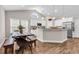 Charming kitchen with white cabinets, modern appliances, and an adjacent dining area at 3864 Journeys End Rd., Murrells Inlet, SC 29576
