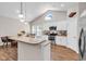 Well-appointed kitchen with a granite island, stainless steel appliances, and ample natural light at 3864 Journeys End Rd., Murrells Inlet, SC 29576