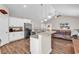 Open-concept kitchen with granite countertops, stainless steel appliances, and a breakfast bar at 3864 Journeys End Rd., Murrells Inlet, SC 29576