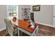 Comfortable office featuring a custom desk, display shelves for collectables, and rolling desk chair at 3864 Journeys End Rd., Murrells Inlet, SC 29576
