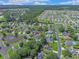Aerial view showcasing the neighborhood's layout, pond, and proximity to natural areas at 3888 Stillwood Dr., Myrtle Beach, SC 29588