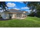Spacious backyard features a pergola-covered patio, perfect for outdoor relaxation at 3888 Stillwood Dr., Myrtle Beach, SC 29588