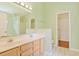Bathroom features double vanity sinks, neutral walls, and a separate room for the toilet and closet at 3888 Stillwood Dr., Myrtle Beach, SC 29588