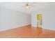 Bright bedroom with hardwood floors, ceiling fan, and easy access to an attached bathroom at 3888 Stillwood Dr., Myrtle Beach, SC 29588