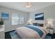 Bedroom features large bed, two beach themed painting and a window with blinds at 3888 Stillwood Dr., Myrtle Beach, SC 29588