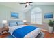Bedroom with a vaulted ceiling, ceiling fan, plantation shutters, and serene beach-themed decor at 3888 Stillwood Dr., Myrtle Beach, SC 29588