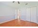 Bedroom with vaulted ceiling, ceiling fan, two-toned paint, wood laminate floor and double closet at 3888 Stillwood Dr., Myrtle Beach, SC 29588