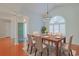 Elegant dining room with vaulted ceiling, modern light fixture, and a view of the entryway at 3888 Stillwood Dr., Myrtle Beach, SC 29588