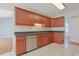Functional kitchen with wood cabinetry, stainless steel appliances, and a view into the dining area at 3888 Stillwood Dr., Myrtle Beach, SC 29588