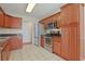 Well-appointed kitchen with wood cabinets, stainless steel appliances, and tile flooring at 3888 Stillwood Dr., Myrtle Beach, SC 29588