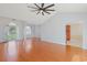 Spacious open-concept living room with hardwood floors and a vaulted ceiling with a ceiling fan at 3888 Stillwood Dr., Myrtle Beach, SC 29588