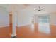 Living room featuring wood floors, bright windows, a ceiling fan, and access to other rooms in the house at 3888 Stillwood Dr., Myrtle Beach, SC 29588