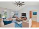 Bright and airy living room with hardwood floors, ceiling fan, vaulted ceiling, and a dining area at 3888 Stillwood Dr., Myrtle Beach, SC 29588