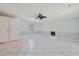 Expansive living room showcasing tile floors, a fireplace, and access to a closet and window at 3888 Stillwood Dr., Myrtle Beach, SC 29588