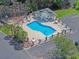 Aerial view of a community pool featuring lounge chairs and a fenced perimeter at 3888 Stillwood Dr., Myrtle Beach, SC 29588