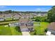 Aerial view of the home showing landscaped yard, pool, and residential surroundings at 405 Spring View Ct., Little River, SC 29566