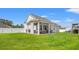 Spacious backyard with covered patio, outdoor seating, and privacy fence at 405 Spring View Ct., Little River, SC 29566