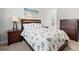 Charming bedroom featuring a nautical-themed bedspread, wooden furniture, and a serene beach painting at 405 Spring View Ct., Little River, SC 29566