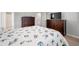 Well-appointed bedroom featuring nautical bedding, wood dressers, and a mounted television for added comfort at 405 Spring View Ct., Little River, SC 29566