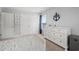 Well-lit bedroom with dresser, anchor decor, and spacious closet at 405 Spring View Ct., Little River, SC 29566