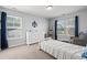 Charming bedroom with nautical accents, natural light, dresser, and bed at 405 Spring View Ct., Little River, SC 29566