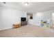 Well-lit bonus room with furnishings and a TV; ideal for play or study at 405 Spring View Ct., Little River, SC 29566