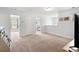 Large bonus room with neutral carpeting featuring access to additional rooms and a view of the TV at 405 Spring View Ct., Little River, SC 29566