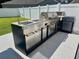 Outdoor stainless steel grill with sink, built-in burners, and granite countertop at 405 Spring View Ct., Little River, SC 29566