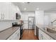 Bright kitchen featuring stainless steel appliances, sleek countertops, and ample cabinet space at 405 Spring View Ct., Little River, SC 29566