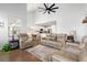 Bright living room with vaulted ceiling, comfortable seating, and a view of the kitchen at 405 Spring View Ct., Little River, SC 29566