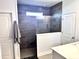 Modern tiled shower with glass enclosure, window, and tiled floors at 405 Spring View Ct., Little River, SC 29566