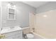 Bathroom with a combined shower and tub, a toilet, and a white sink with a vanity at 4249 E Highway 9, Loris, SC 29569