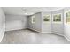 Bright bedroom with neutral walls, lots of natural light, and stylish vinyl floors at 4249 E Highway 9, Loris, SC 29569