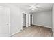 Bedroom featuring wood-look flooring, ceiling fan, double closets and natural light at 4249 E Highway 9, Loris, SC 29569