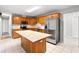 Well-equipped kitchen featuring stainless steel appliances, central island, and classic wood cabinetry at 4249 E Highway 9, Loris, SC 29569
