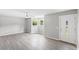 Bright living room with neutral walls, lots of natural light, and stylish vinyl floors at 4249 E Highway 9, Loris, SC 29569