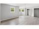 Spacious main bedroom with neutral walls, lots of natural light, walk-in closets, and stylish vinyl floors at 4249 E Highway 9, Loris, SC 29569