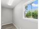 Bright room featuring wood floors, a crisp white trim window overlooking lush greenery at 4249 E Highway 9, Loris, SC 29569