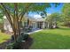 The backyard features a lush lawn, patio, and screened porch at 428 Arlington Circle, Murrells Inlet, SC 29576