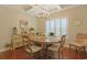 Dining room with coffered ceilings, hardwood floors, chandelier, and plenty of natural light at 428 Arlington Circle, Murrells Inlet, SC 29576